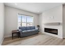 254 Alpine Boulevard Sw, Calgary, AB  - Indoor Photo Showing Living Room With Fireplace 