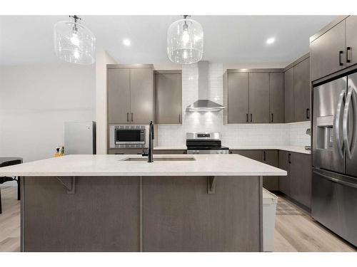 254 Alpine Boulevard Sw, Calgary, AB - Indoor Photo Showing Kitchen With Stainless Steel Kitchen With Upgraded Kitchen