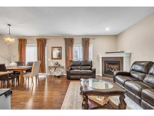 127 Brightoncrest Rise Se, Calgary, AB - Indoor Photo Showing Living Room With Fireplace