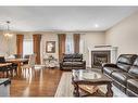 127 Brightoncrest Rise Se, Calgary, AB  - Indoor Photo Showing Living Room With Fireplace 