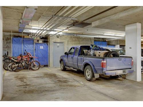 224-15 Sunset Square, Cochrane, AB - Indoor Photo Showing Garage