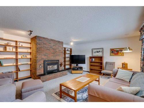 3410 Breton Close Nw, Calgary, AB - Indoor Photo Showing Living Room With Fireplace