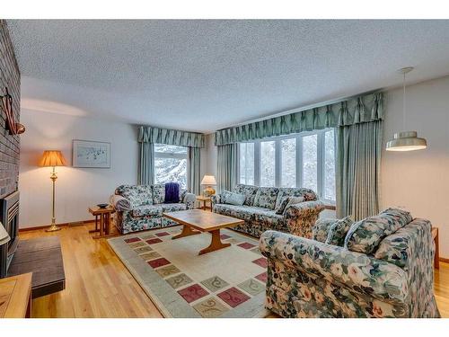 3410 Breton Close Nw, Calgary, AB - Indoor Photo Showing Living Room With Fireplace