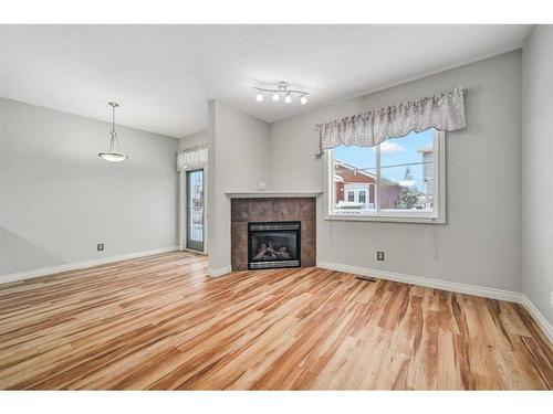 46 Tucker Circle, Okotoks, AB - Indoor Photo Showing Living Room With Fireplace