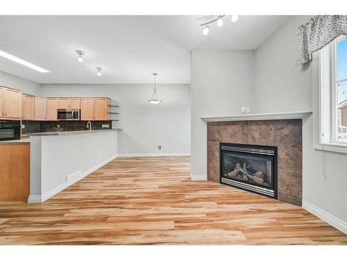 46 Tucker Circle, Okotoks, AB - Indoor With Fireplace