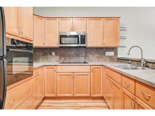 46 Tucker Circle, Okotoks, AB - Indoor Photo Showing Kitchen With Double Sink