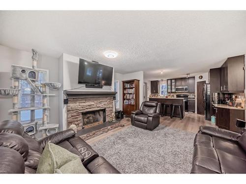 1 Harvest Oak View Ne, Calgary, AB - Indoor Photo Showing Living Room With Fireplace