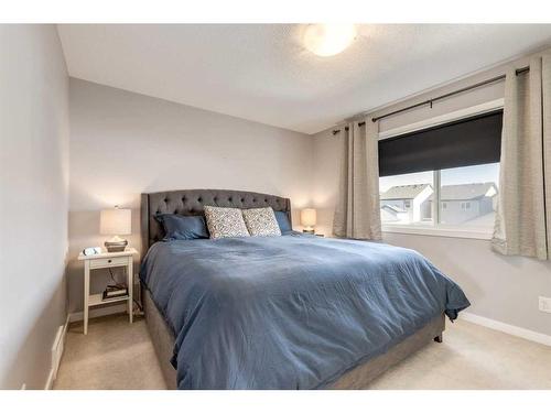 1233 New Brighton Drive Se, Calgary, AB - Indoor Photo Showing Bedroom