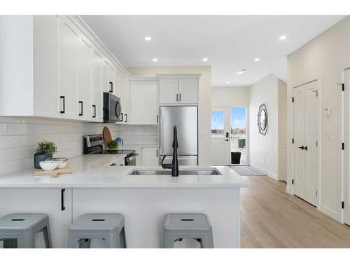 17 Cottageclub Lane, Rural Rocky View County, AB - Indoor Photo Showing Kitchen With Upgraded Kitchen