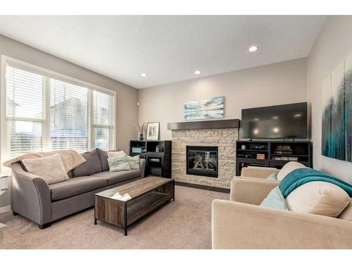 175 Cranford Green Se, Calgary, AB - Indoor Photo Showing Living Room With Fireplace