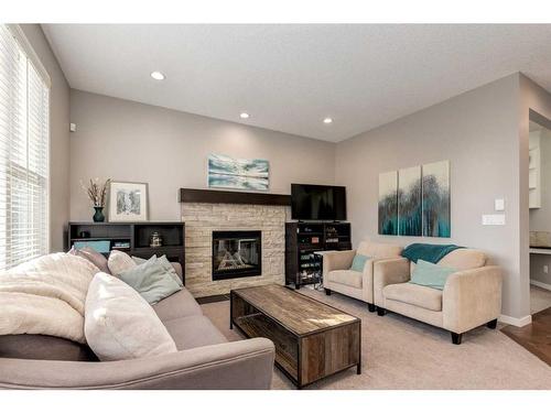 175 Cranford Green Se, Calgary, AB - Indoor Photo Showing Living Room With Fireplace