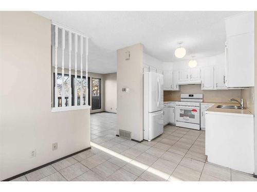 305 Templemont Place Ne, Calgary, AB - Indoor Photo Showing Kitchen With Double Sink