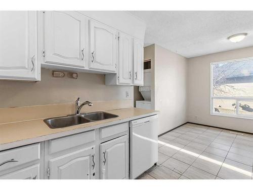 305 Templemont Place Ne, Calgary, AB - Indoor Photo Showing Kitchen With Double Sink