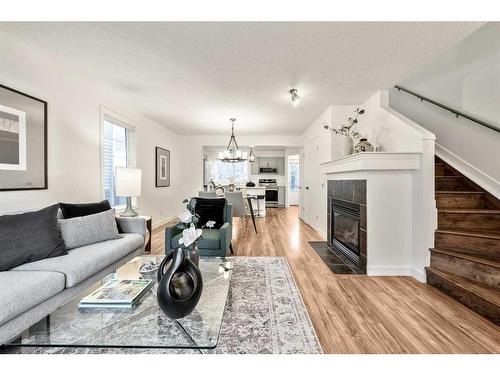 25 Elgin Mews Se, Calgary, AB - Indoor Photo Showing Living Room With Fireplace