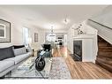 25 Elgin Mews Se, Calgary, AB  - Indoor Photo Showing Living Room With Fireplace 