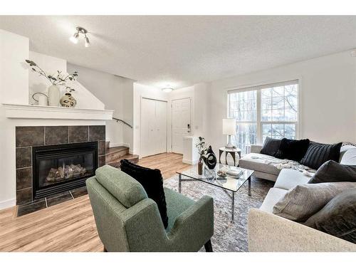 25 Elgin Mews Se, Calgary, AB - Indoor Photo Showing Living Room With Fireplace