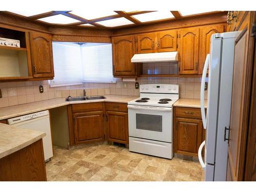 4032 Marbank Drive Ne, Calgary, AB - Indoor Photo Showing Kitchen With Double Sink