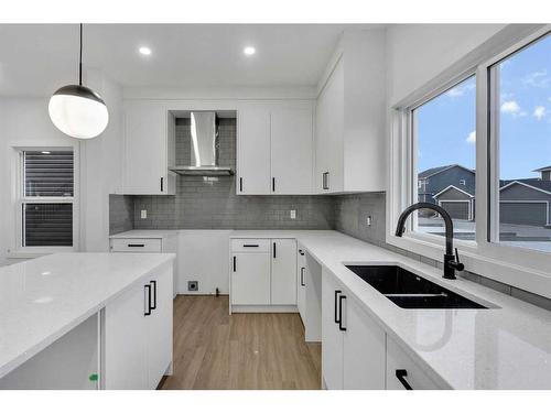 824 Midtown Drive Sw, Airdrie, AB - Indoor Photo Showing Kitchen With Double Sink