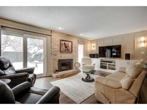 14136 Park Estates Drive Se, Calgary, AB - Indoor Photo Showing Living Room With Fireplace