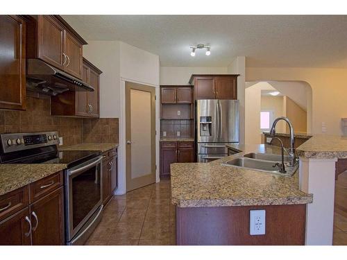 109 Bridlerange Place Sw, Calgary, AB - Indoor Photo Showing Kitchen With Double Sink With Upgraded Kitchen