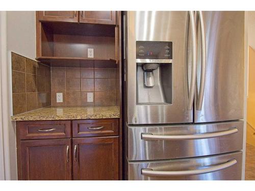 109 Bridlerange Place Sw, Calgary, AB - Indoor Photo Showing Kitchen