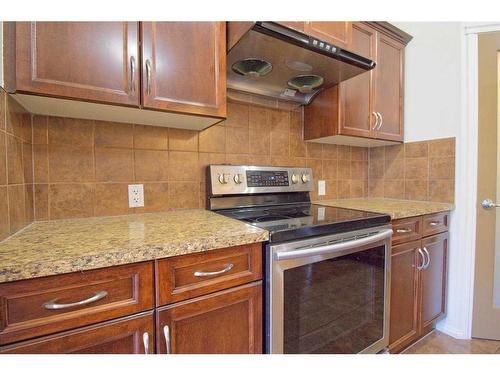 109 Bridlerange Place Sw, Calgary, AB - Indoor Photo Showing Kitchen