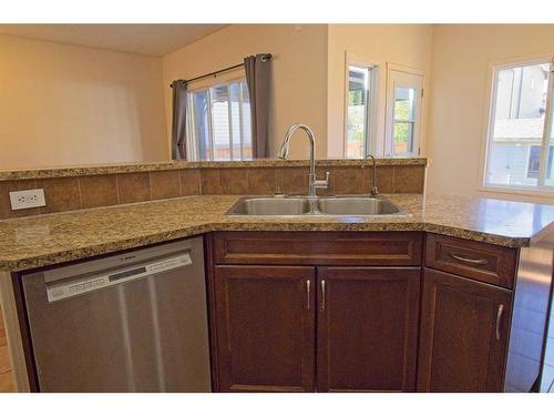 109 Bridlerange Place Sw, Calgary, AB - Indoor Photo Showing Kitchen With Double Sink