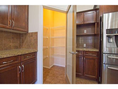 109 Bridlerange Place Sw, Calgary, AB - Indoor Photo Showing Kitchen