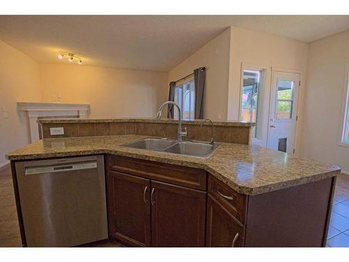 109 Bridlerange Place Sw, Calgary, AB - Indoor Photo Showing Kitchen With Double Sink