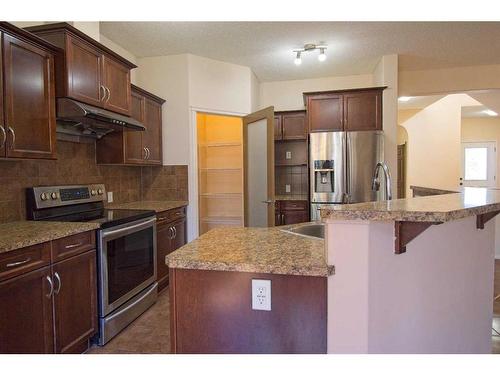 109 Bridlerange Place Sw, Calgary, AB - Indoor Photo Showing Kitchen With Upgraded Kitchen