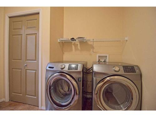 109 Bridlerange Place Sw, Calgary, AB - Indoor Photo Showing Laundry Room