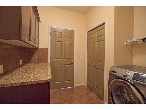 109 Bridlerange Place Sw, Calgary, AB - Indoor Photo Showing Laundry Room