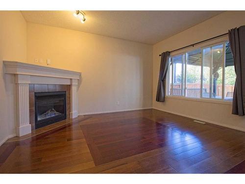 109 Bridlerange Place Sw, Calgary, AB - Indoor Photo Showing Other Room With Fireplace