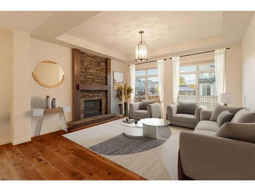 309 Marquis Landing Se, Calgary, AB - Indoor Photo Showing Living Room With Fireplace