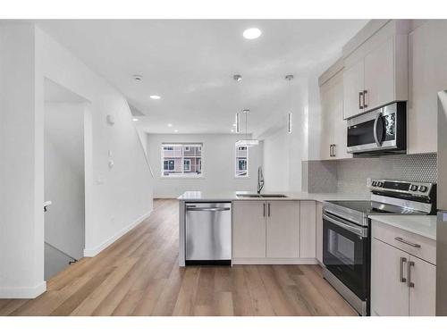 109-75 Cornerstone Row Ne, Calgary, AB - Indoor Photo Showing Kitchen With Stainless Steel Kitchen With Double Sink With Upgraded Kitchen