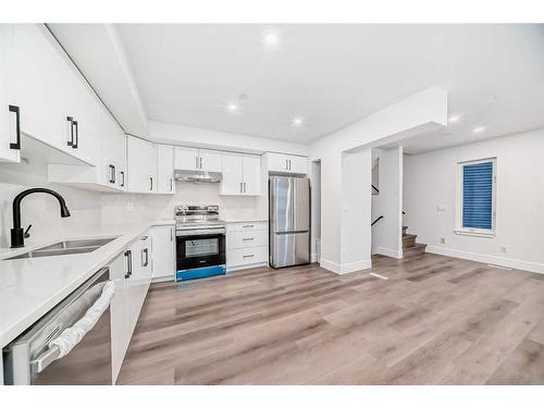 227 Saratoga Place Ne, Calgary, AB - Indoor Photo Showing Kitchen With Stainless Steel Kitchen With Double Sink With Upgraded Kitchen