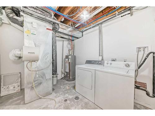 227 Saratoga Place Ne, Calgary, AB - Indoor Photo Showing Laundry Room