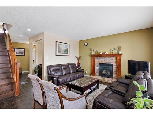 173 Everoak Circle Sw, Calgary, AB - Indoor Photo Showing Living Room With Fireplace