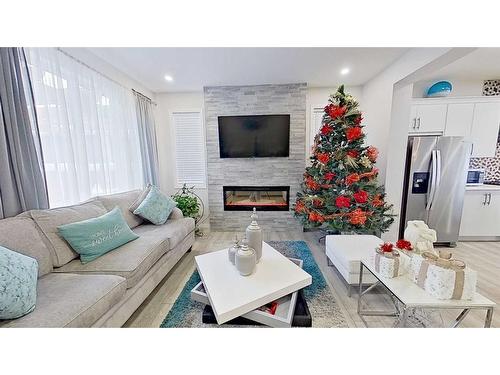 150 Yorkville Green Sw, Calgary, AB - Indoor Photo Showing Living Room With Fireplace