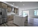 87 Hotchkiss Manor Se, Calgary, AB  - Indoor Photo Showing Kitchen With Stainless Steel Kitchen With Upgraded Kitchen 