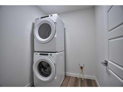 87 Hotchkiss Manor Se, Calgary, AB - Indoor Photo Showing Laundry Room