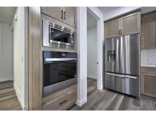 87 Hotchkiss Manor Se, Calgary, AB - Indoor Photo Showing Kitchen With Stainless Steel Kitchen