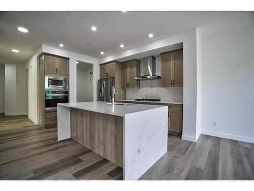 87 Hotchkiss Manor Se, Calgary, AB - Indoor Photo Showing Kitchen With Upgraded Kitchen