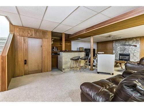 12040 Candiac Road Sw, Calgary, AB - Indoor Photo Showing Other Room With Fireplace