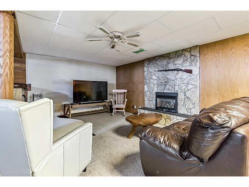 12040 Candiac Road Sw, Calgary, AB - Indoor With Fireplace