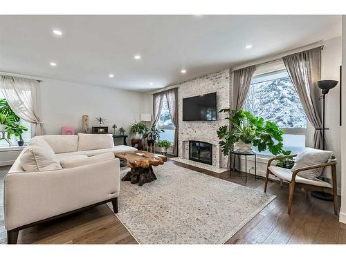 12040 Candiac Road Sw, Calgary, AB - Indoor Photo Showing Living Room With Fireplace