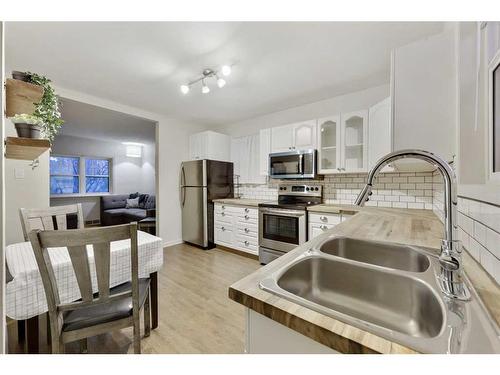 517 13 Avenue Ne, Calgary, AB - Indoor Photo Showing Kitchen With Double Sink