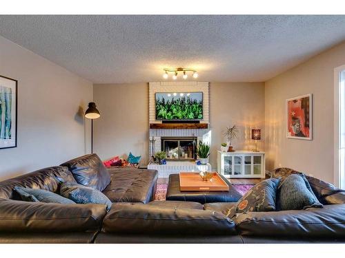 44 Sanderling Rise Nw, Calgary, AB - Indoor Photo Showing Living Room With Fireplace