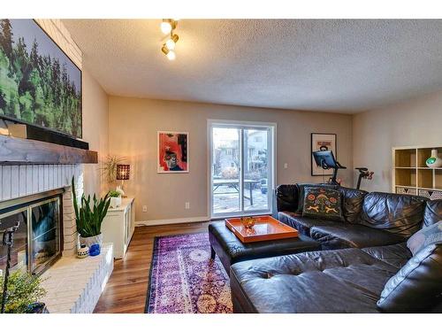 44 Sanderling Rise Nw, Calgary, AB - Indoor Photo Showing Living Room With Fireplace