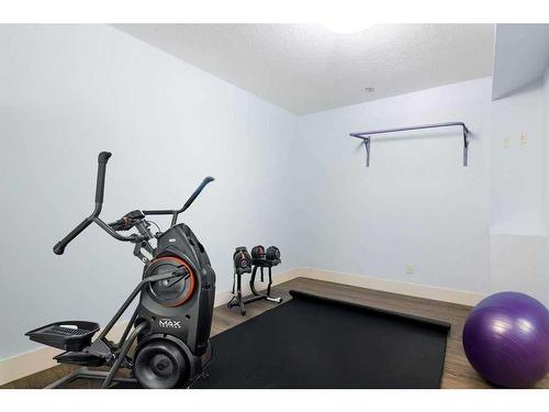 27 Auburn Sound Cove Se, Calgary, AB - Indoor Photo Showing Gym Room